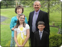 Pastor Michael Harper with his wife Amy and their two children, Abigail and Daniel
